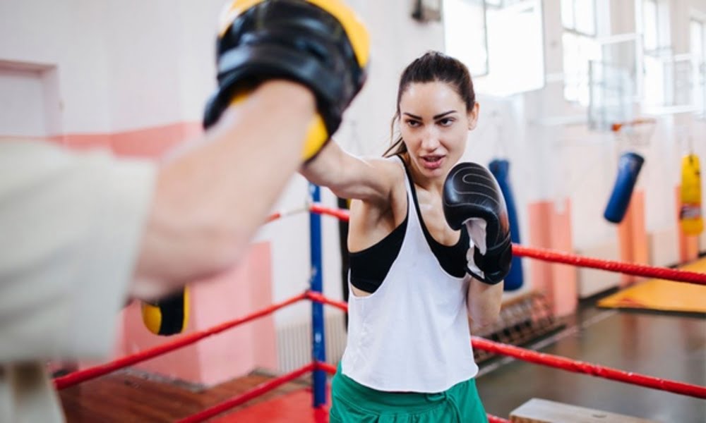 Ultimate Guide to Boxing Gyms in Dubai A women in the box ring in Dubai